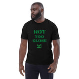 Not To Close Unisex 100% Organic Cotton T-Shirt with green logo available in black and white .