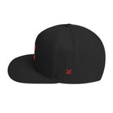 Yupoong snapback hat in black with flat peak and red front and side embroidered logo's. Design by Kodish